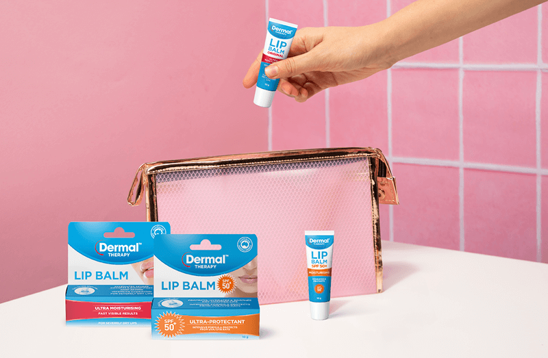 Promotional image set on a bathroom background with pink wall and titles on a white surface, showcasing selected range of Dermal Therapy products.